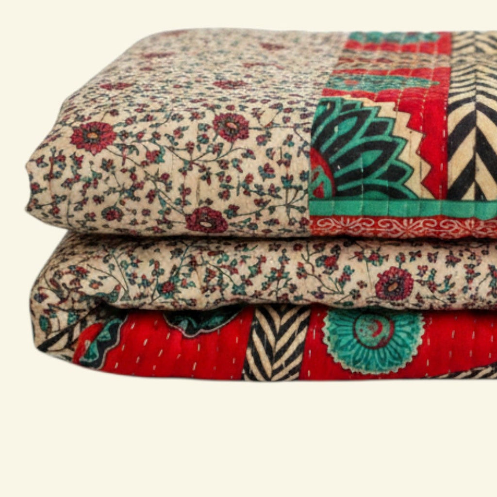 Colorful quilt with geometric patterns on a beige background