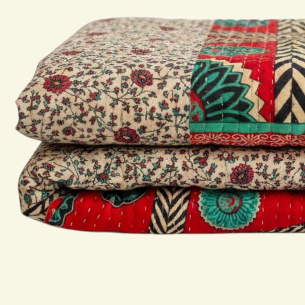 Colorful quilt with geometric patterns on a beige background