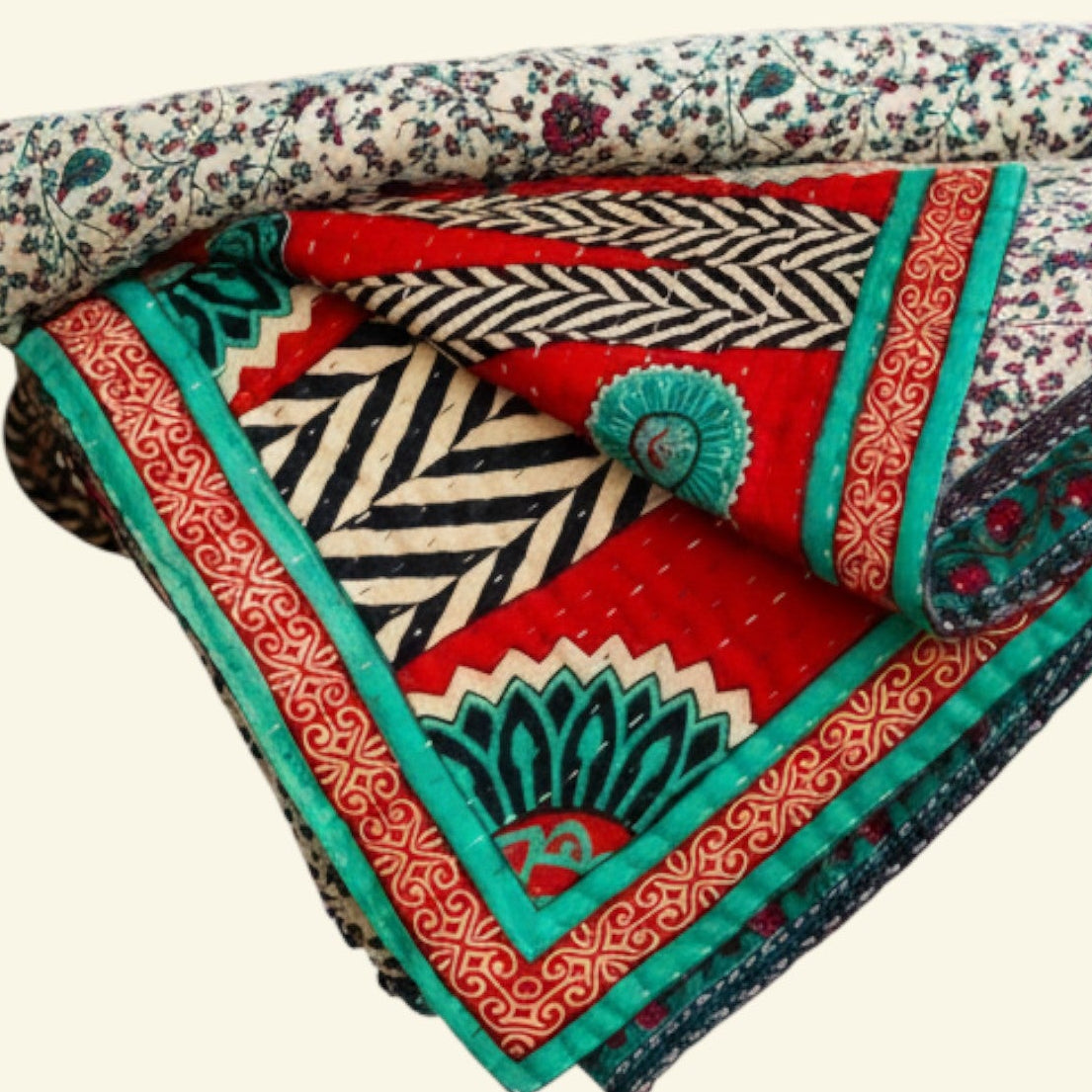 Colorful quilt with geometric patterns on a white background