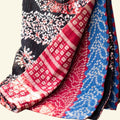 Colorful patterned fabric on a beige background