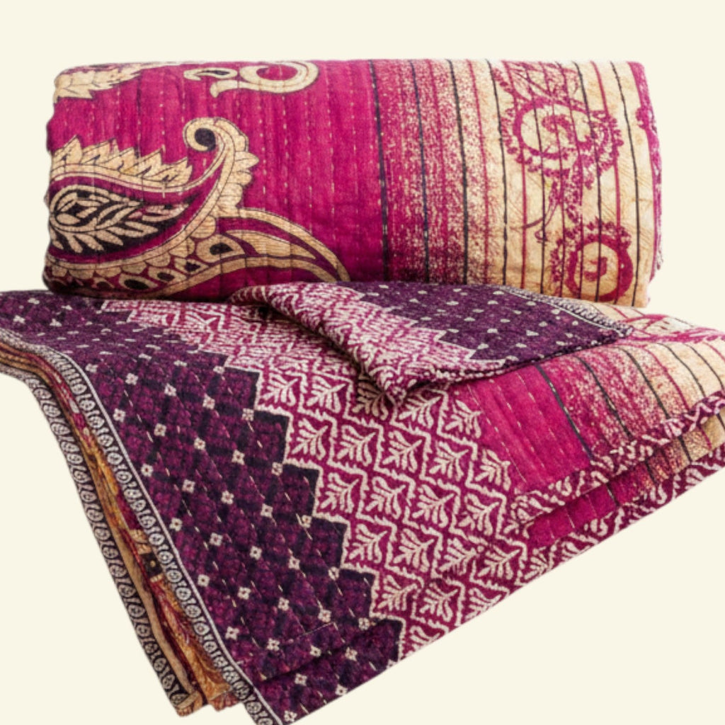 Colorful quilt with intricate patterns on a white background