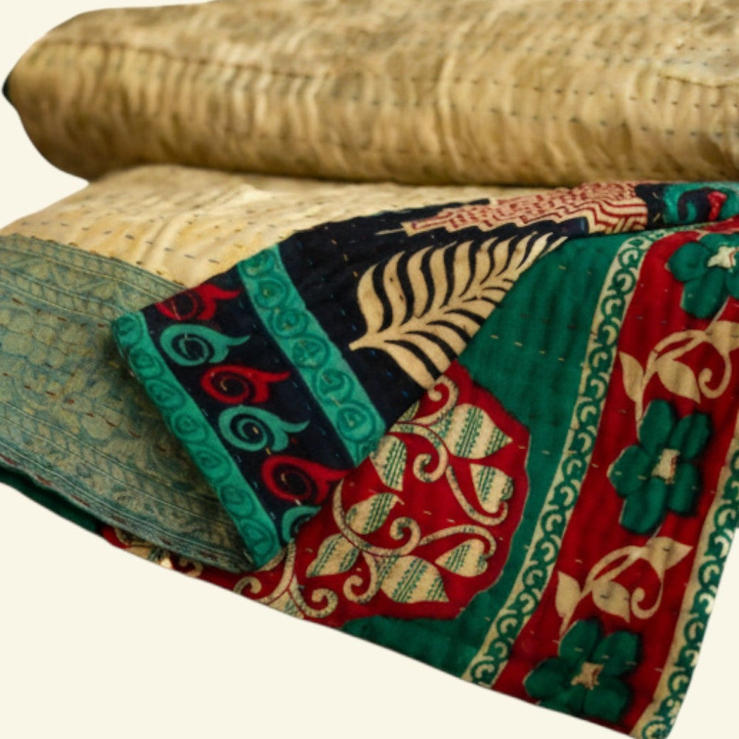 Rolled-up fabric with colorful patterns on a beige background