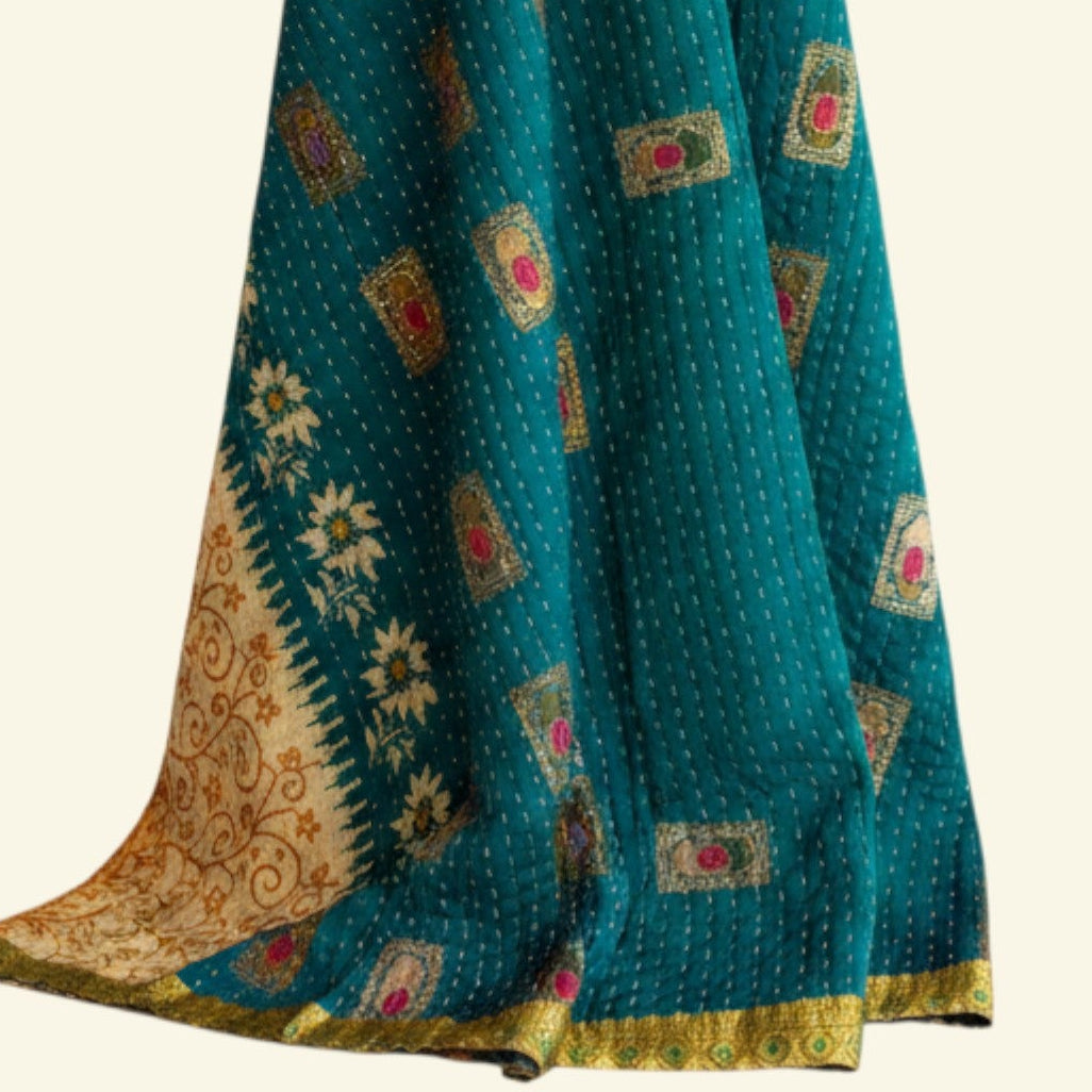 Teal fabric with floral patterns on a white background