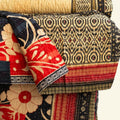 Colorful quilt with intricate patterns on a white background