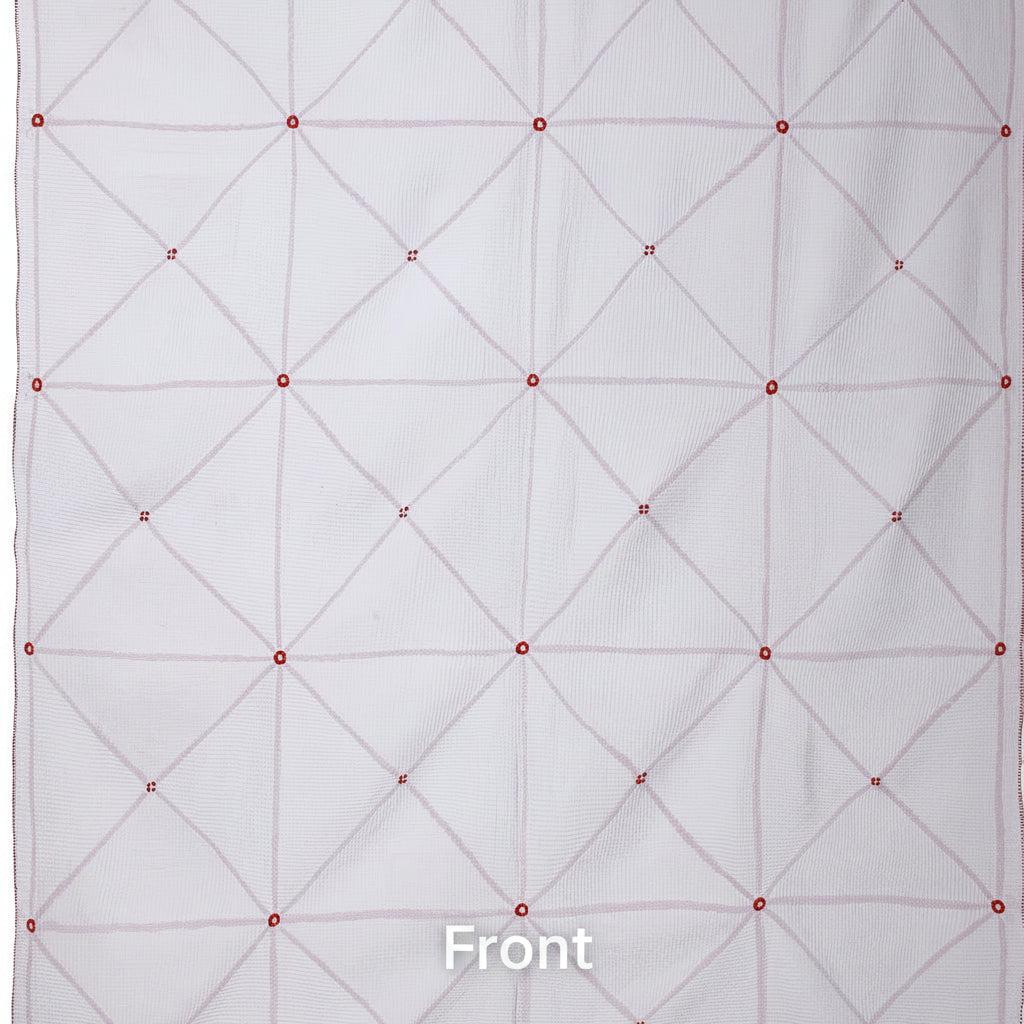 White quilt with red diamond pattern on a white background