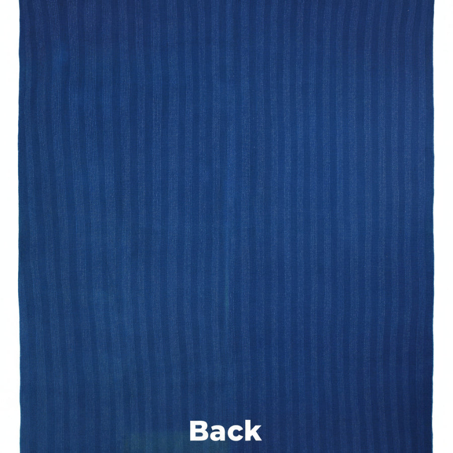 Solid blue rug with a subtle pattern on a white background