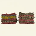 Two stacks of patterned fabric on a beige background