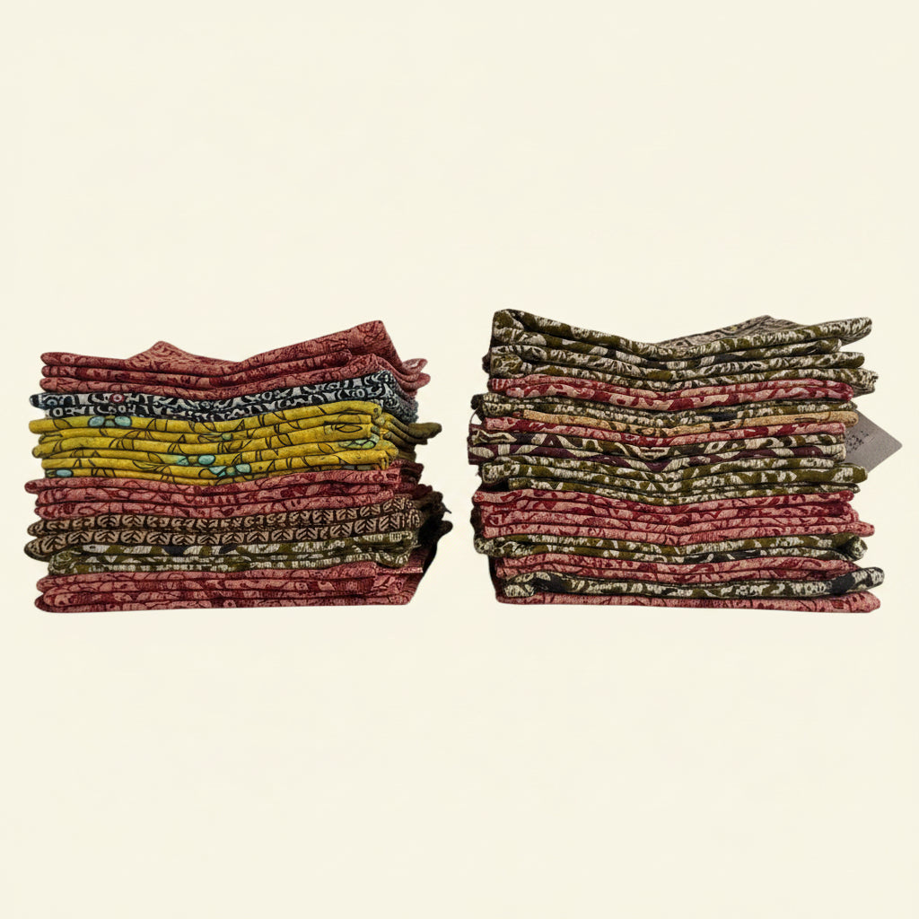 Two stacks of patterned fabric on a beige background